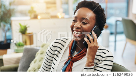 Black woman, happy and phone call on sofa in home for friendly chat, networking and conversation. Relax, person and talking to contact in living room with funny gossip, communication and discussion Black woman, happy and phone call on sofa in home for friendly chat, networking and conversation. Relax, person and talking to contact in living room with funny gossip, communication and discussion 126249026