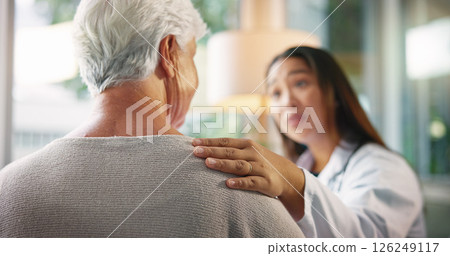 Empathy, doctor and senior patient in hospital, checkup and support with healthcare, consulting and ill. Clinic, medical professional and care for elderly person with dementia, sickness and diagnosis 126249117