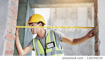 Tape measure, engineer and man at door for construction, building and development. Builder, frame and check width with tools for architecture, renovation and inspection for installation accuracy Tape measure, engineer and man at door for construction, building and development. Builder, frame and check width with tools for architecture, renovation and inspection for installation accuracy 126249239