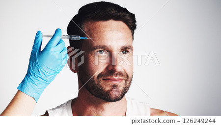 Forehead, needle and beauty with man in studio for filler injection, anti aging and aesthetic treatment. Collagen benefits, wrinkles and cosmetics with mature person and hand on white background 126249244