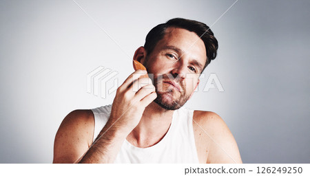 Portrait, comb and man with beard in studio for wellness, grooming and haircare on white background. Skincare, space and person with tools for facial hair, growth and styling for morning routine Portrait, comb and man with beard in studio for wellness, grooming and haircare on white background. Skincare, space and person with tools for facial hair, growth and styling for morning routine 126249250