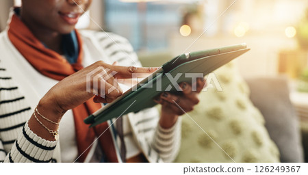 Woman, hands or tablet in home to search for online blog, interior design and social media post. Digital app, living room or female person on touchscreen technology for house renovation tips on couch 126249367