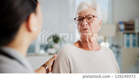 Sad woman, doctor and empathy in office, healthcare and consultation with support, help or cancer. Pensioner, senior patient or medical with professional, results or sympathy with stress or diagnosis 126249372