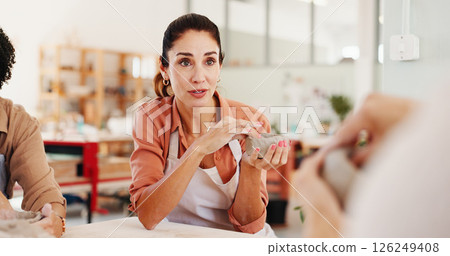 Pottery class, teaching and woman in ceramic workshop for help, conversation and clay product. Instructor, small business and mentor in studio for support, feedback and creative sculpture design mold 126249408