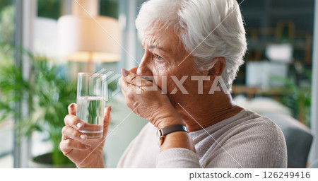 Senior woman, water and medicine in home for healthcare, wellness and treatment. Glass, drink and elderly person with medication for prescription supplement, vitamin c pills and hydration in lounge Senior woman, water and medicine in home for healthcare, wellness and treatment. Glass, drink and elderly person with medication for prescription supplement, vitamin c pills and hydration in lounge 126249416