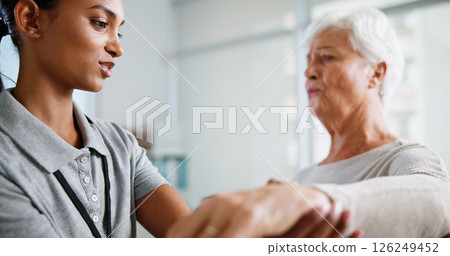 Physical therapy, wrist pain and woman with mature patient for medical service, support and wellness. Healthcare, chiropractor and physiotherapist with person for consulting, mobility or stretching Physical therapy, wrist pain and woman with mature patient for medical service, support and wellness. Healthcare, chiropractor and physiotherapist with person for consulting, mobility or stretching 126249452