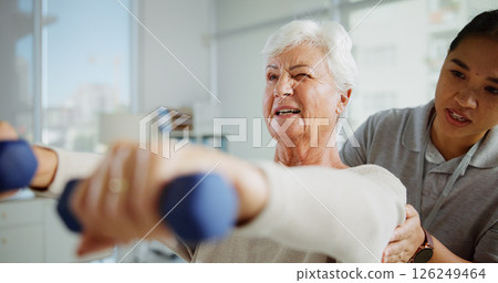 Physical therapy, weights and woman with mature patient for medical service, support and muscle strength. Healthcare, wellness and physiotherapist with person for consulting, mobility and arthritis Physical therapy, weights and woman with mature patient for medical service, support and muscle strength. Healthcare, wellness and physiotherapist with person for consulting, mobility and arthritis 126249464