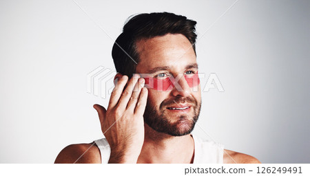 Smile, skincare and eye mask with man in studio for dermatology, self care and anti aging treatment. Glow, collagen patch and beauty with mature person on white background for shine and facial Smile, skincare and eye mask with man in studio for dermatology, self care and anti aging treatment. Glow, collagen patch and beauty with mature person on white background for shine and facial 126249491
