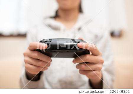 Hands of children playing games 126249591