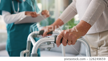 Doctor, physiotherapist or patient hands with walker for assisted living, exam or test at clinic. Closeup, medical worker or nurse helping person with a disability for mobility, movement or recovery 126249659