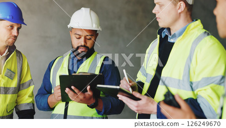 Man, clipboard and group at construction site in meeting, review or planning for renovation project. Lead engineer, checklist and staff for writing, tablet or problem solving for property development 126249670