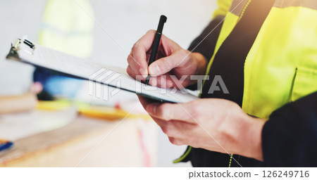Man, hands and contractor with clipboard for construction, industrial career and building renovation of development. Engineer, architect and site inspection for maintenance or infrastructure project 126249716
