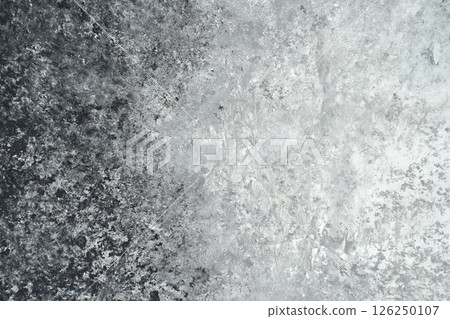Abstract textured surface with black and white gradients in a rough concrete 126250107