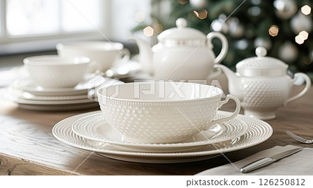 Still life served festive dinner table while Christmas lights glowing 126250812