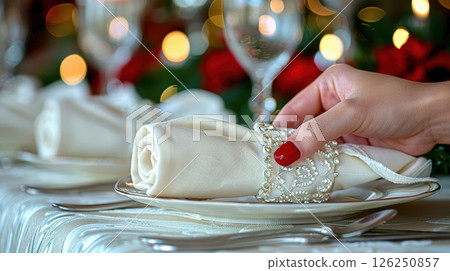 Still life served festive dinner table while Christmas lights glowing 126250857