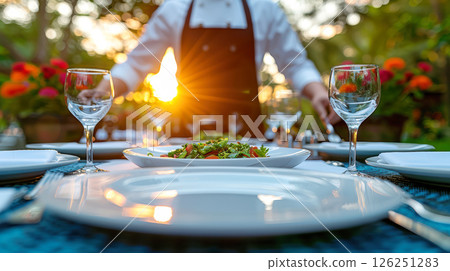 Still life served festive dinner table while Christmas lights glowing 126251283