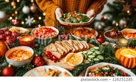 Still life served festive dinner table while Christmas lights glowing 126251285