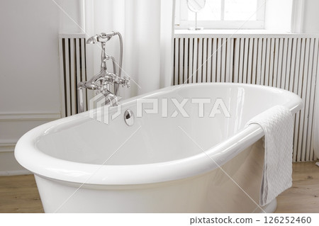 Modern elegant minimalist bathroom interior with curtains and window and freestanding bathtub Modern elegant minimalist bathroom interior with curtains and window and freestanding bathtub 126252460