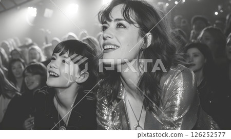 happy people celebrating and having fun at carnival among colorful decorations 126252577