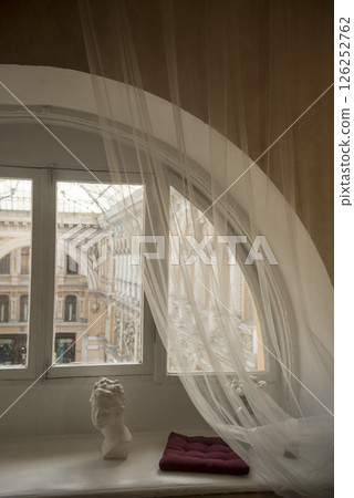 arched window in the room. white wooden frames arched window in the room. white wooden frames 126252762