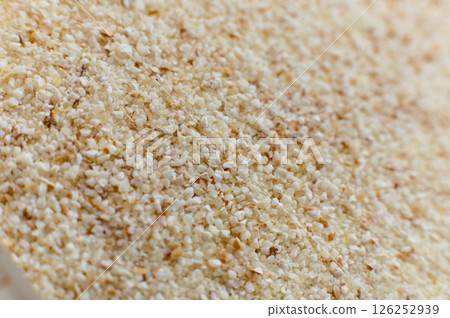 Close-up of raw semolina background in macro mode and soft focus 126252939