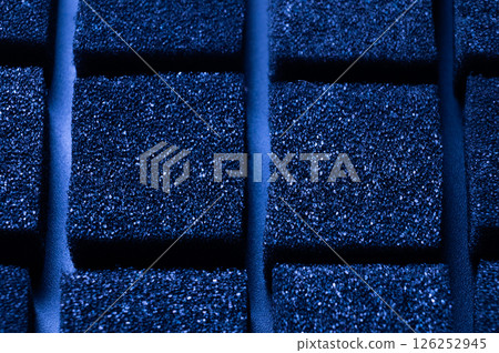 Blue Cubes of flexible foam sponges laid out in a pattern. Macro close-up in soft focus. Abstract cubic background Blue Cubes of flexible foam sponges laid out in a pattern. Macro close-up in soft focus. Abstract cubic background 126252945
