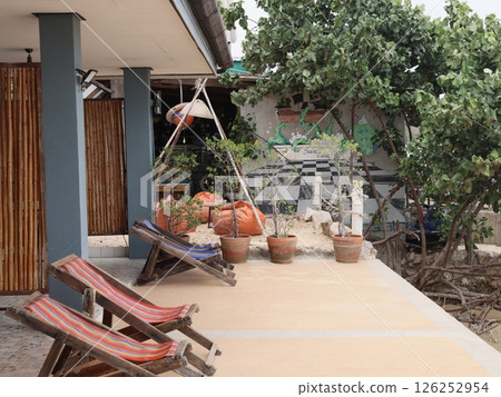 A Cozy Outdoor Space Perfect with Comfortable Hammocks and Beautiful Potted Plants 126252954