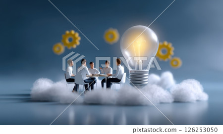 A group of people are sitting around a table with a light bulb in the middle 126253050
