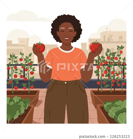 Woman Holding Fresh Tomatoes in Urban Garden with Green Plants and Cityscape Background 126253223