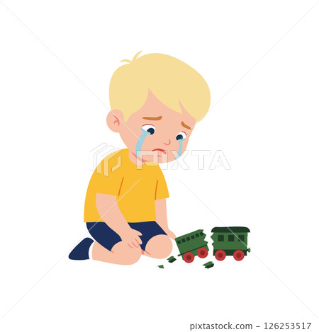 Crying sad boy in yellow shirt playing with broken green toy train vector illustration 126253517