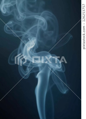 Delicate tendrils of smoke rise and twist in fluid motions, creating captivating forms against a muted backdrop. This visual speaks to the beauty of ephemeral moments. Generative AI 126253757