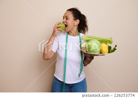 Woman Embracing Healthy Choices with Fruits and Vegetables for Wellness Woman Embracing Healthy Choices with Fruits and Vegetables for Wellness 126253774