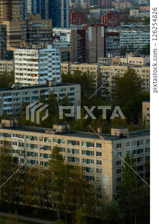 urban landscape with tall buildings and several trees, residential area, multi-storey buildings. 126254826