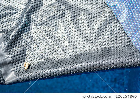 Retractable floating pool cover to keep out leaves and keep in heat being pulled back from water. Retractable floating pool cover to keep out leaves and keep in heat being pulled back from water. 126254860