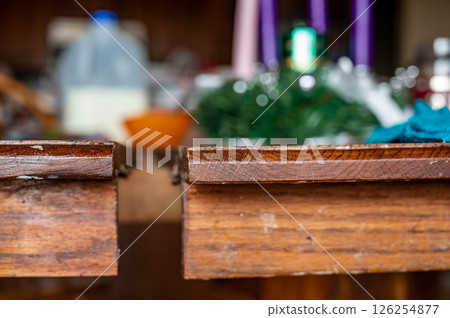 Gap in a kitchen table to add or remove sections. Gap in a kitchen table to add or remove sections. 126254877