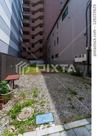 Narrow vacant lot, gap between apartment buildings Narrow vacant lot, gap between apartment buildings 126255629