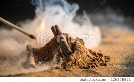 cinnamon powder with lit match. Background concept. Generated Image 126256831