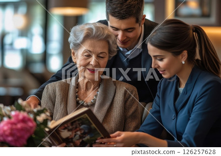 Cherishing memories family bonds over a book in a cozy living room heartwarming moment of love and connection close-up view 126257628