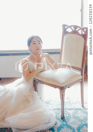 A woman in a dress surrounded by soft light | Perfect for courses, advertisements, and covers 126258134