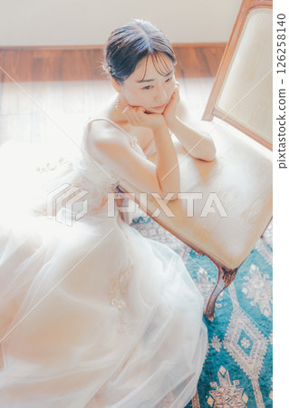 A woman in a dress surrounded by soft light | Perfect for courses, advertisements, and covers 126258140