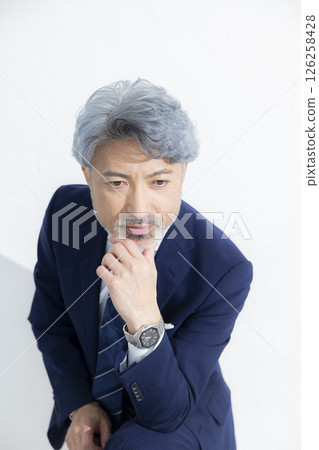 A cool guy in a suit A cool guy in a suit 126258428