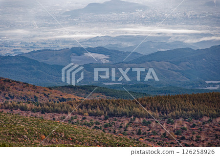 A view of the autumn leaves on the mountainside of Mt. Adatara and the cityscape in the direction of Fukushima City 126258926