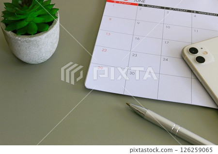 Calendar and smartphone Schedule Shift management Plan Calendar and smartphone Schedule Shift management Plan 126259065
