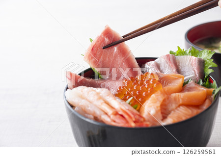 Bowl of rice topped with sashimi Bowl of rice topped with sashimi 126259561
