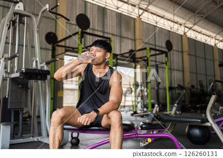 Fitness: Hydrating After Workout in Gym drink of water Fitness: Hydrating After Workout in Gym drink of water 126260131