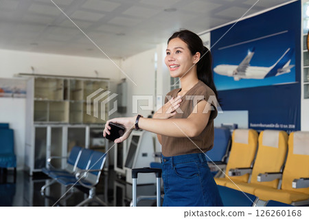 Travel excitement at the airport with woman showing gratitude 126260168