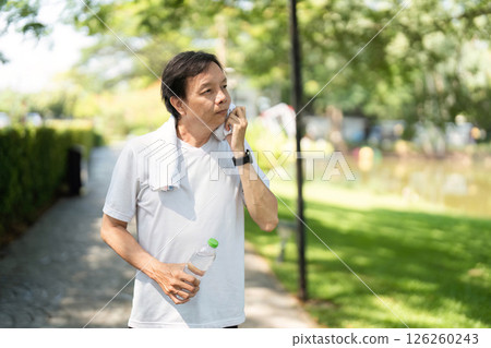 Wellness and Hydration. Man refreshing after workout with water bottle. 126260243