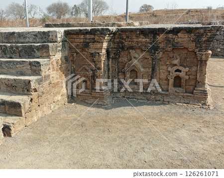 The remains of a pagoda with a double-headed eagle sculpture remaining at the Sirkap ruins, an ancient city ruin from around the time of Christ in Taxila, Pakistan The remains of a pagoda with a double-headed eagle sculpture remaining at the Sirkap ruins, an ancient city ruin from around the time of Christ in Taxila, Pakistan 126261071