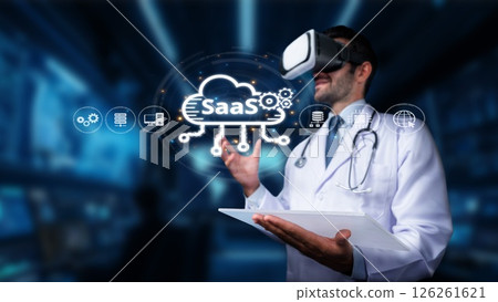 Doctor in Virtual Reality Headset Exploring Software as a Service Cloud Technology in Medical Environment for Innovative Healthcare Solutions. PHMT Doctor in Virtual Reality Headset Exploring Software as a Service Cloud Technology in Medical Environment for Innovative Healthcare Solutions. PHMT 126261621