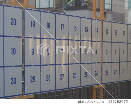 An election bulletin board bathed in the setting sun An election bulletin board bathed in the setting sun 126262675